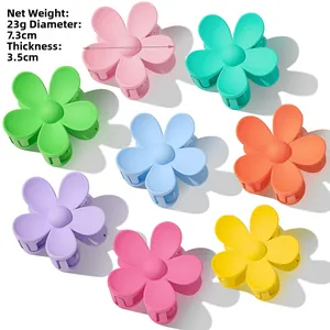 Détails des pinces à cheveux fleurs montrant 7,3 cm de diamètre et 23g de poids