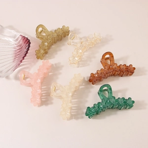 Detailed collection of large floral hair claws in six colors with smooth acrylic finish