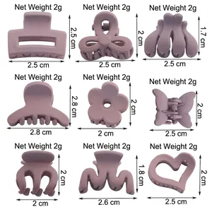 Set of nine matte grey-purple small hair claws in geometric and floral shapes
