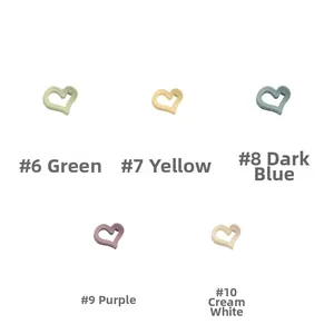 Detail view of five matte hollow heart-shaped hair claws in assorted pastel colors