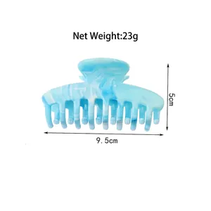Blue marble patterned hair claw clip measuring 9.5cm in length with 23g net weight