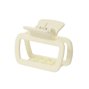 Detail view of a matte cream square hair claw clip showing a sturdy spring and non-slip teeth