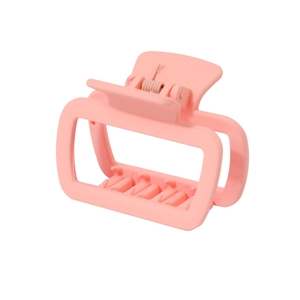 Detail view of pink matte square hair claw clip with non-slip teeth and metal spring