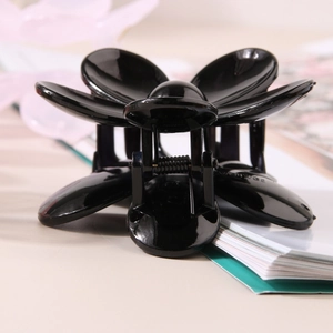 Glossy black flower hair claw clip with elegant five-petal design and metal spring for women