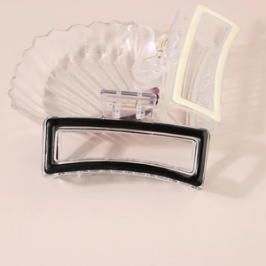 Rectangle hair claw clips in black and cream finish with transparent acrylic texture