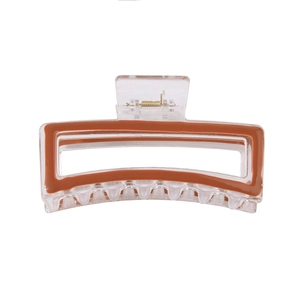 Minimalist transparent acrylic hair claw clip with brown trim and gold metal spring