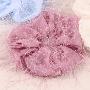 Three fluffy mesh organza scrunchies in soft pink, blue, and beige colors