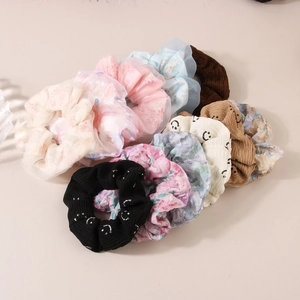 Assorted mesh and knit heart scrunchies for ponytails in various colors and patterns