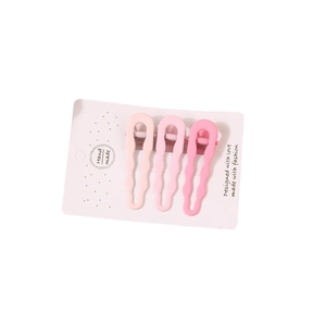 Three-piece set of pink wavy seamless hair clips on a white presentation card