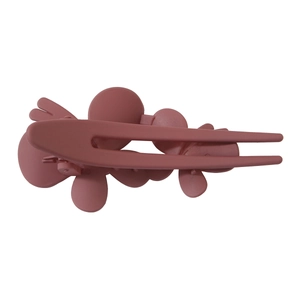 Detail view of the matte mauve floral hair claw clip featuring three layered flower designs