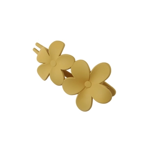 Detail of matte ginger yellow flower hair claw clip with twin floral design and spring
