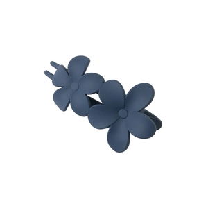 Close-up of a matte dark blue double flower hair claw clip with a secure metal spring