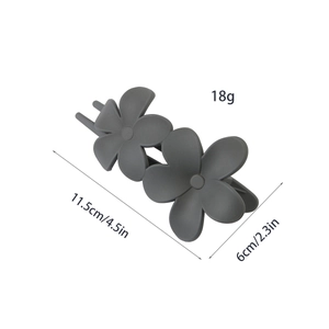 Detail view of matte flower hair claw clip with precise weight and size dimensions