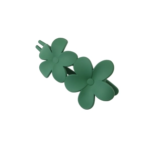 Close-up of dark green matte floral hair clip featuring two elegant five-petal flowers