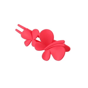 Detailed macro view of a rose pink butterfly hair clip with matte plastic texture