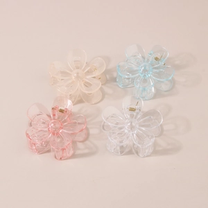 Set of four 7cm hollow flower hair claws in champagne, blue, pink, and clear resins