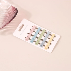 Detail of 20-piece colorful macaron hair clip set arranged on white display card