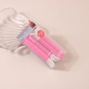 Detailed view of two pink hair volume clips in fillimilli packaging for styling