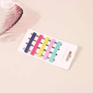 Close-up of 20 candy-colored wavy hair clips set in five vibrant colors on white cards
