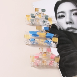 Three-piece geometric transparent hair claws with gold foil accents and artistic paint strokes