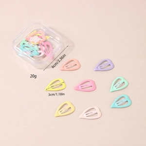 Detailed view of colorful heart-shaped hair clips in a clear storage box with dimensions