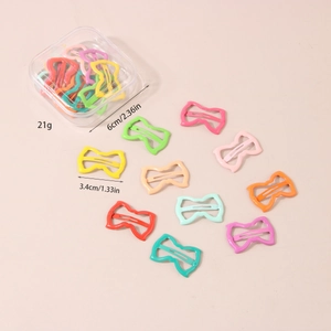 Detailed view showing dimensions of colorful bow hair clips in a transparent storage box