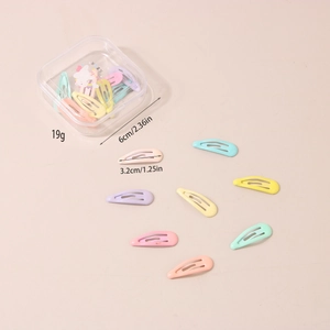 Detailed view of candy colored drop star hair clips in a clear storage box for girls