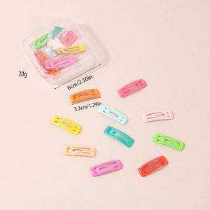 Detailed size view of 10 colorful candy star hair clips in a 6cm clear storage box