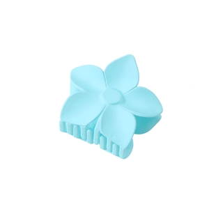 Detail view of light blue matte flower hair claw clip with sturdy plastic teeth