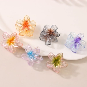 Set of six 4cm glitter plumeria hair claws in various translucent gradient colors