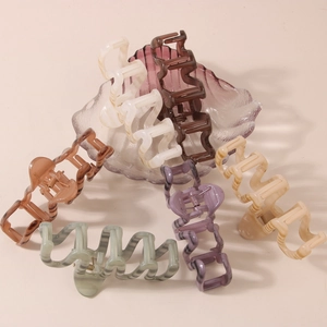 Set of multi-color wavy geometric hair claws in minimalist plastic and acetate