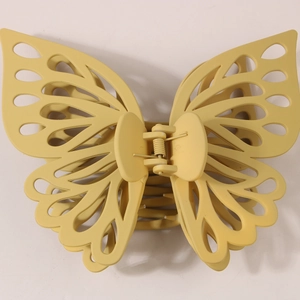 Matte mustard yellow hollow butterfly hair claw clip with large double-layered design