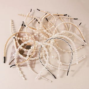 Elegant pearl headband collection featuring gold frames and assorted faux pearl designs