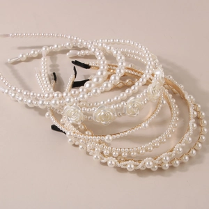 Elegant pearl headbands in cream and gold with floral accents for women