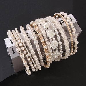 Elegant pearl headband set with cream white beads and camellia resin accents in gold finish