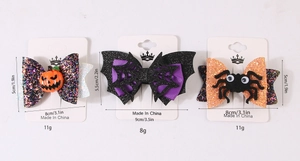 Detailed Halloween hair clip set featuring sequined pumpkin, bat web, and spider designs