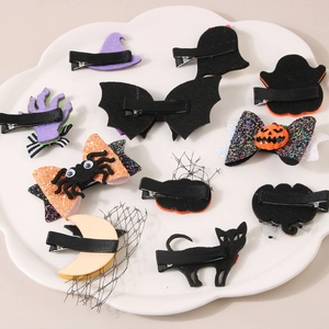 Halloween hair clips set featuring pumpkin, ghost, and bat designs for festive styling