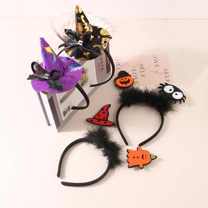 Close-up of Halloween headbands with witch hats, plush spiders and spring ghosts