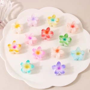 Colorful 4cm frangipani flower hair claws in multiple gradient shades for women
