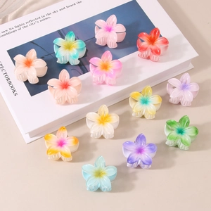 Detailed view of 4cm colorful gradient frangipani hair claws in various vibrant resin shades