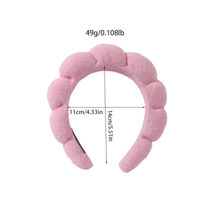 Pink plush cloud headband with padded wave design and 5.51 inch height dimension