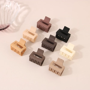 Detail view showing a variety of 4cm matte finish hair claws in earth tone colors