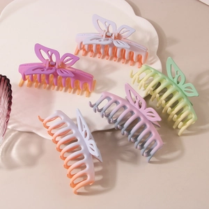 Five-piece butterfly matte large hair claw clips set in various gradient colors on a tray