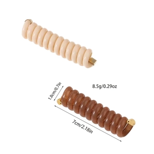 Spiral telephone wire hair ties in beige and brown with gold ends for ponytails