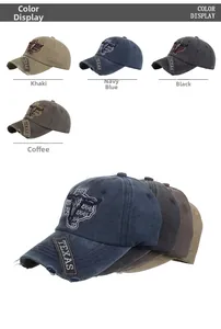 Detail of vintage washed Texas baseball caps with bull head embroidery in four colors