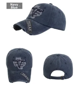 Close-up of vintage navy blue TEXAS baseball cap with distressed brim and bull embroidery
