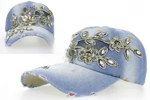 Detail of light blue denim baseball cap with crystal rhinestones and flower embroidery