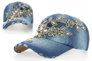 Detailed blue denim baseball cap with floral embroidery and rhinestone accents