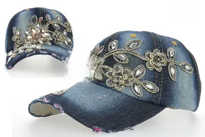 Detailed embroidery with gold thread and sparkling rhinestones on washed denim baseball cap