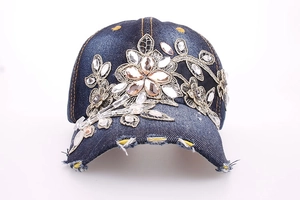 Distressed dark blue denim baseball cap with gold floral embroidery and rhinestones